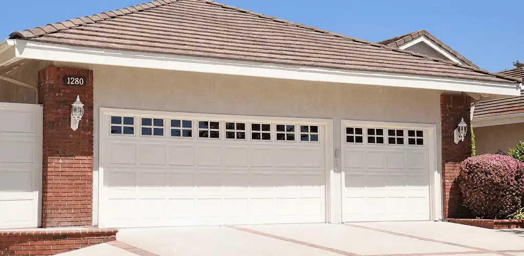 Residential garage door repair service for a double garage door in Oklahoma City, OK
