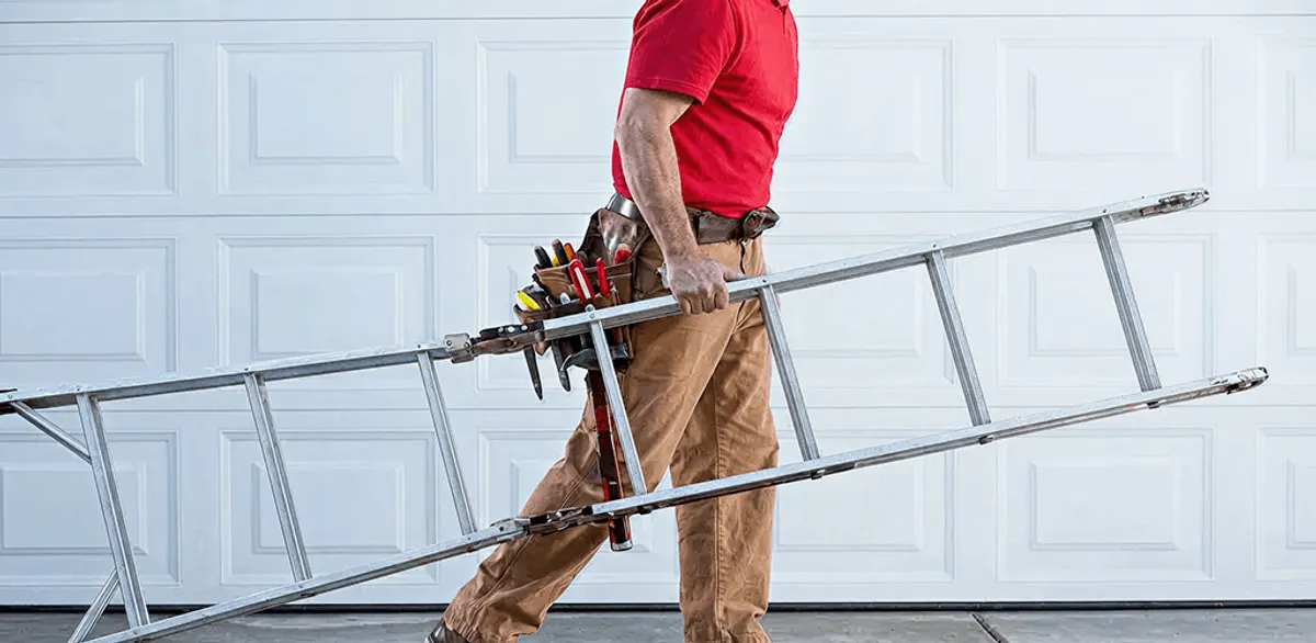 Garage door repair technician arriving with tools and ladder in Oklahoma City, OK