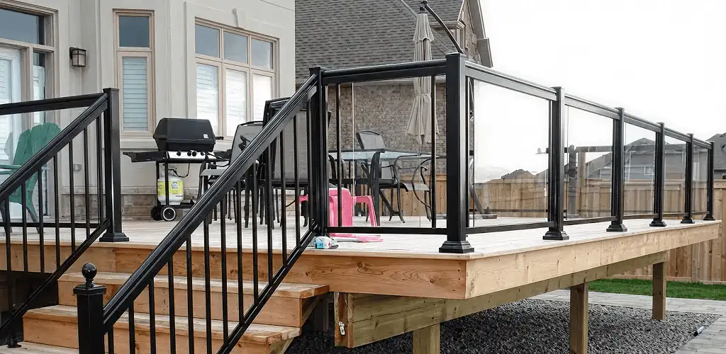 Handrail installation on a deck staircase for safety and code compliance in Oklahoma City, OK