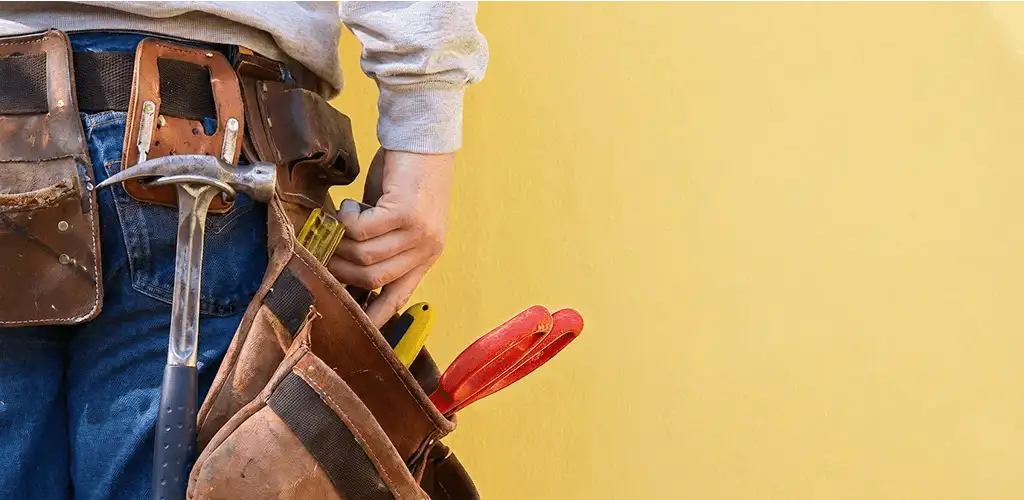 Handyman with tool belt ready for home repairs and maintenance in Oklahoma City, OK